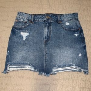 Distressed mini jean skirt
